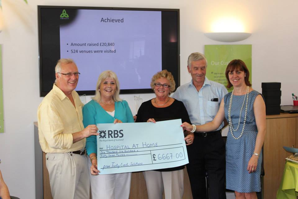 Trinity hand over cheques to Charities for the Trinity Triple Challenge